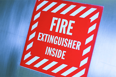 A Sign In Red Saying Fire Extinguisher Inside 1